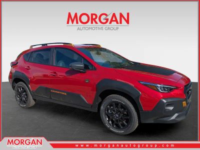 2026 Subaru Crosstrek Wilderness in Lithium Red Pearl — front three-quarter view