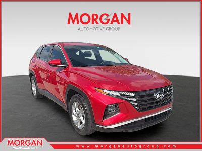 2022 Hyundai Tucson SE in Calypso Red — front three-quarter view