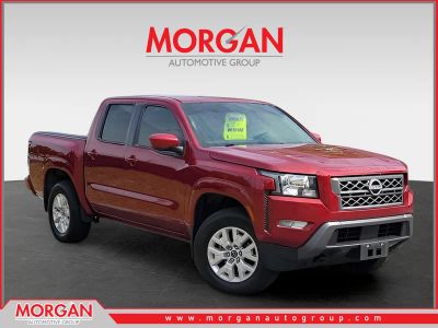 2023 Nissan Frontier SV in Red — front three-quarter view