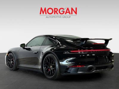 2023 Porsche 911 — rear three-quarter view