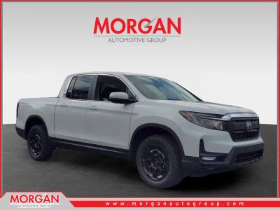 2025 Honda Ridgeline RTL+ in Platinum White — front three-quarter view