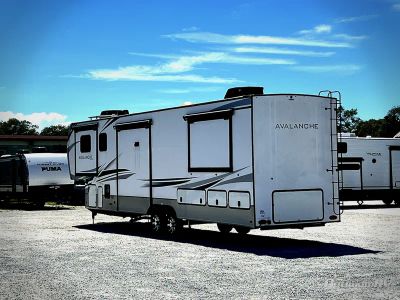 2023 Keystone Avalanche — rear three-quarter view