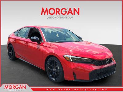 2026 Honda Civic Hatchback Sport in Rallye Red — front three-quarter view