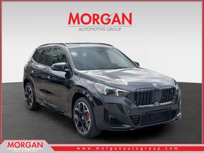 2026 BMW X1 M35i in Black Sapphire Metallic — front three-quarter view