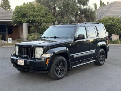2012 Jeep Liberty in Black — front three-quarter view