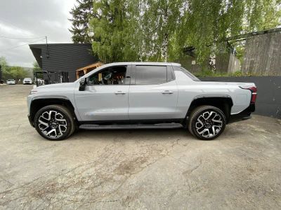 2025 Chevrolet Silverado EV — rear three-quarter view