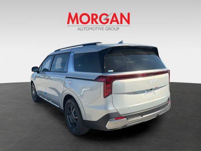 2026 Kia Carnival Hybrid — rear three-quarter view