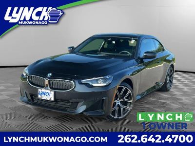 2024 BMW 2 series 230i xDrive in Black Sapphire Metallic — front three-quarter view