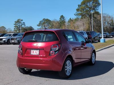 2013 Chevrolet Sonic — rear three-quarter view