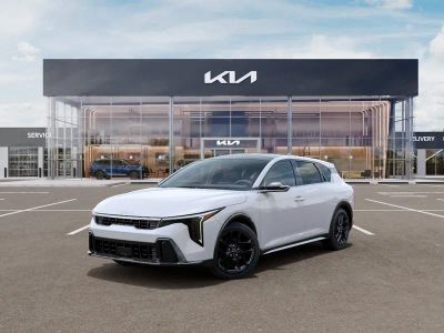 2026 Kia K4 GT-Line Turbo in Snow White Pearl — front three-quarter view
