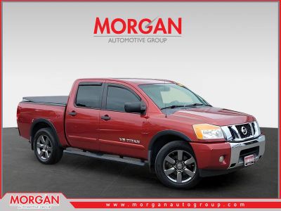2015 Nissan Titan SV in Red — front three-quarter view