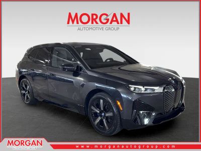 2025 BMW iX xDrive50 in Gray — front three-quarter view