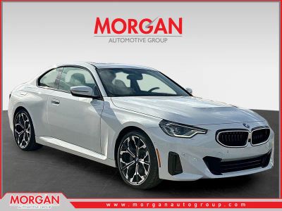 2026 BMW 2 Series 230i in Alpine White — front three-quarter view