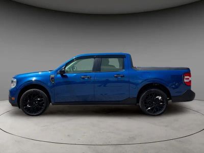 2024 Ford Maverick XLT in Atlas Blue Metallic — front three-quarter view