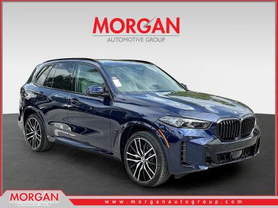 2026 BMW X5 sDrive40i in Tanzanite Blue II Metallic — front three-quarter view