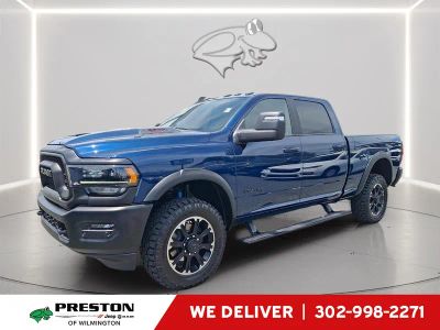 2024 RAM 2500 Rebel in Patriot Blue Pearlcoat — front three-quarter view