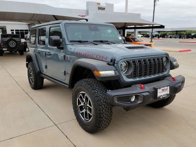2026 Jeep Wrangler Rubicon in Anvil Clear Coat — front three-quarter view