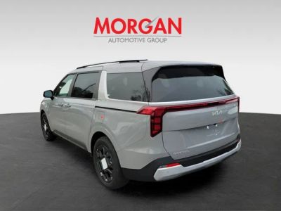 2026 Kia Carnival Hybrid — rear three-quarter view