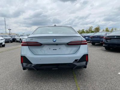 2027 BMW 5 Series — rear three-quarter view