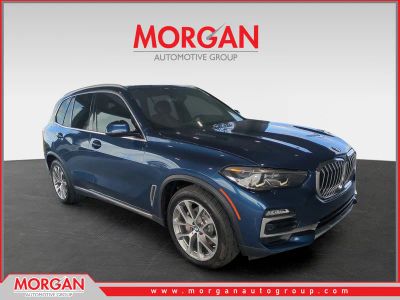 2021 BMW X5 xDrive40i in Phytonic Blue Metallic — front three-quarter view