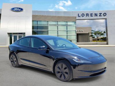 2025 Tesla Model 3 — rear three-quarter view