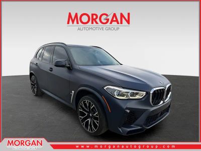 2021 BMW X5 M Base in Tanzanite Blue II Metallic — front three-quarter view