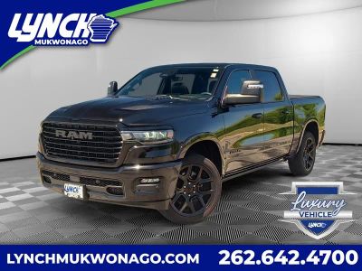 2025 RAM 1500 Laramie in Diamond Black Crystal Pearlcoat — front three-quarter view