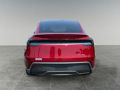 2026 Tesla Model Y — rear three-quarter view