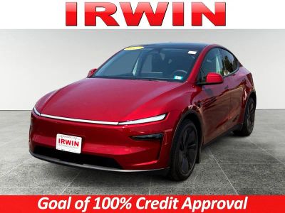2026 Tesla Model Y Long Range Launch Series in Red — front three-quarter view