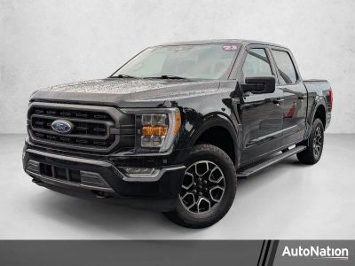 2023 Ford F-150 XLT 4WD SuperCrew 5.5' Box in Agate Black Metallic — front three-quarter view