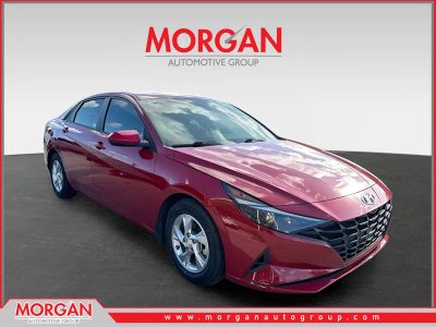 2022 Hyundai Elantra SE in Scarlet Red Pearl — front three-quarter view