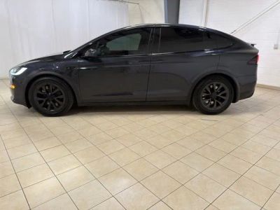 2024 Tesla Model X — rear three-quarter view