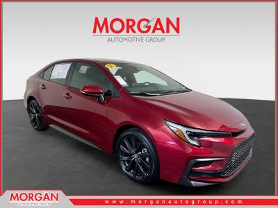 2023 Toyota Corolla SE in Ruby Flare Pearl — front three-quarter view