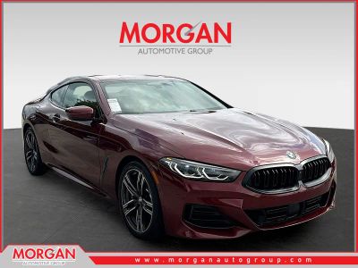 2023 BMW 8 Series 840i in Aventurin Red Metallic — front three-quarter view