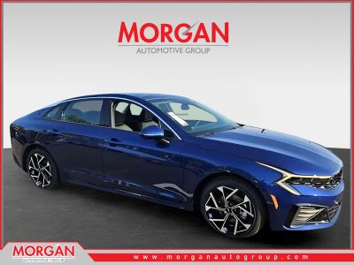 2025 Kia K5 EX in Blue — front three-quarter view
