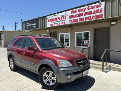2004 Kia Sorento in Burgundy — front three-quarter view