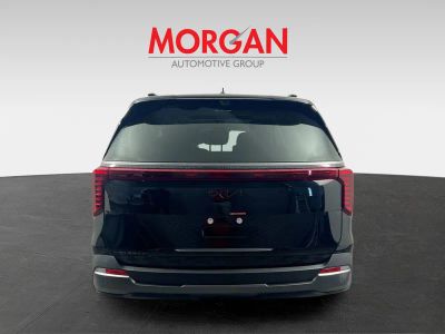 2026 Kia Carnival — rear three-quarter view