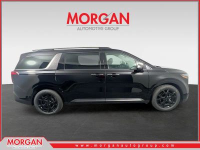 2026 Kia Carnival SX in Aurora Black Pearl — front three-quarter view