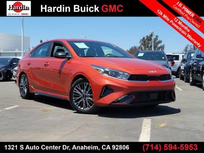 2024 Kia Forte GT-Line in Orange — front three-quarter view