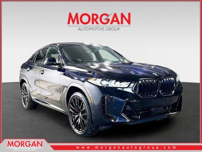 2026 BMW X6 xDrive40i in Carbon Black Metallic — front three-quarter view