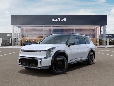 2026 Kia EV9 GT-Line in Glacial White Pearl/Ebony Black Roof — front three-quarter view
