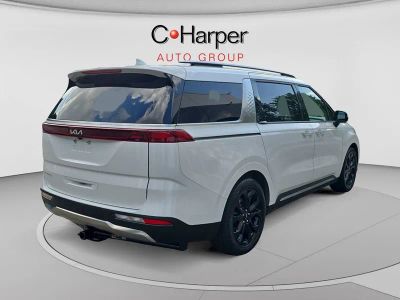 2024 Kia Carnival MPV — rear three-quarter view