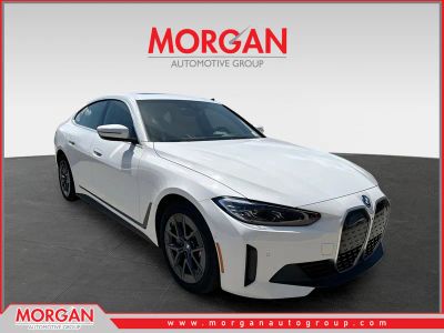 2024 BMW i4 xDrive40 in Alpine White — front three-quarter view
