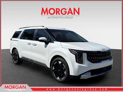 2026 Kia Carnival EX in Snow White Pearl — front three-quarter view