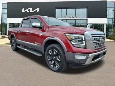2021 Nissan Titan Platinum Reserve in Cardinal Red — front three-quarter view