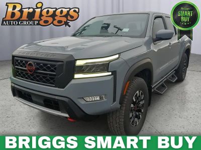 2023 Nissan Frontier PRO-4X in Boulder Gray Pearl — front three-quarter view