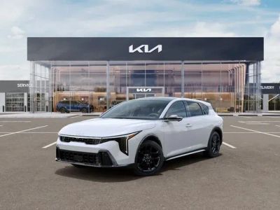 2026 Kia K4 GT-Line Turbo in Snow White Pearl — front three-quarter view
