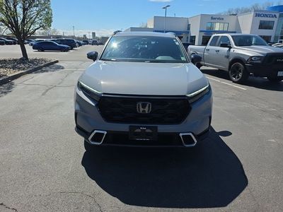 2024 Honda CR-V Hybrid Sport Touring — rear three-quarter view