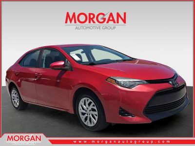2019 Toyota Corolla LE in Red — front three-quarter view