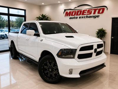 2015 RAM 1500 in White — front three-quarter view